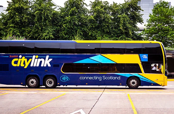 A blue and yellow double decker citylink coach.