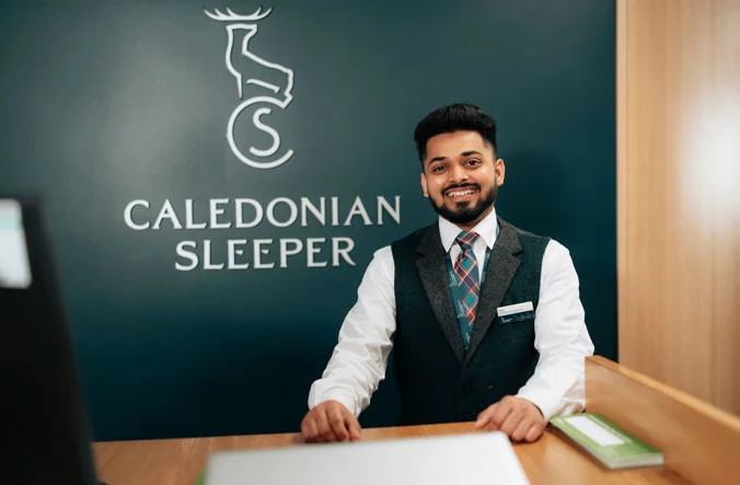 Representative for Caledonian Sleeper smiling.