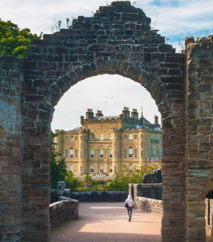 Culzean Castle viewed through an archway in part of the ruins within the country park. 