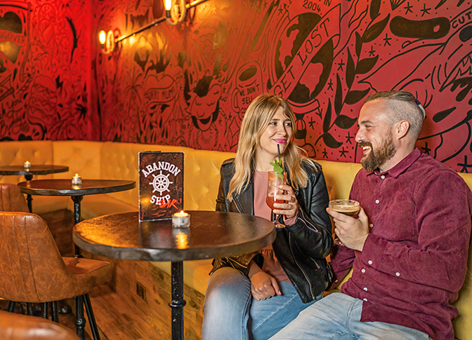 A couple enjoying a drink in Dundee