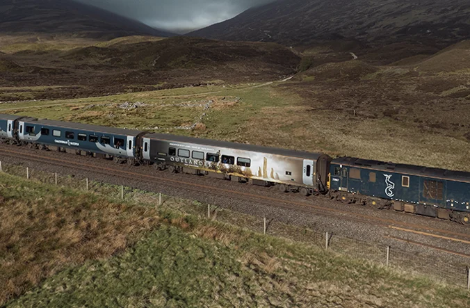 Aerial view of the Outlander wrapped Caledonian Sleeper train.
