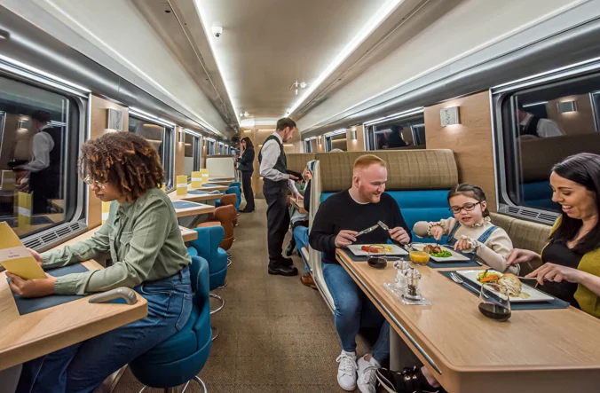 People in busy Club Car
