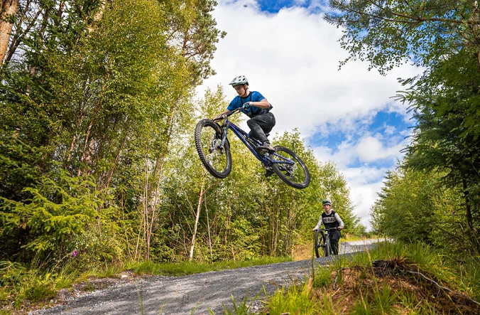 Cyclist jumping on Laggan Wolftrax
