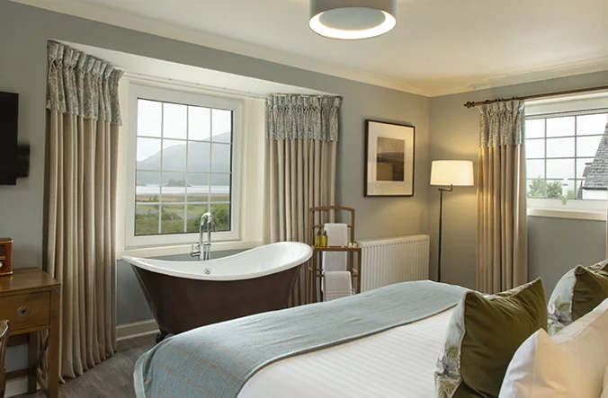 Interior of the Loch View room. Featuring a rolltop bath.